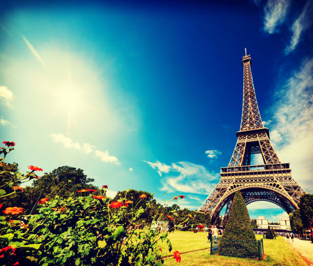 istock Sun shining over world famous Eiffel tower in Paris 1063365180