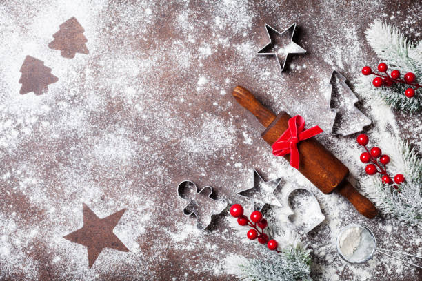 istock Christmas baking background with flour and rolling pin decorated with fir tree top view. 1063366652
