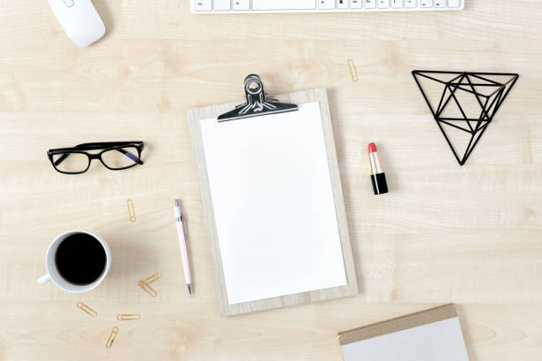istock Feminine workspace lipboard and accessories top view 1063367250