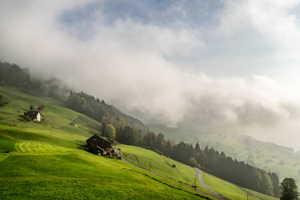 cloud on the hillsides of the swiss alps