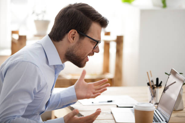 istock Irritated business person sitting working in office 1063372132