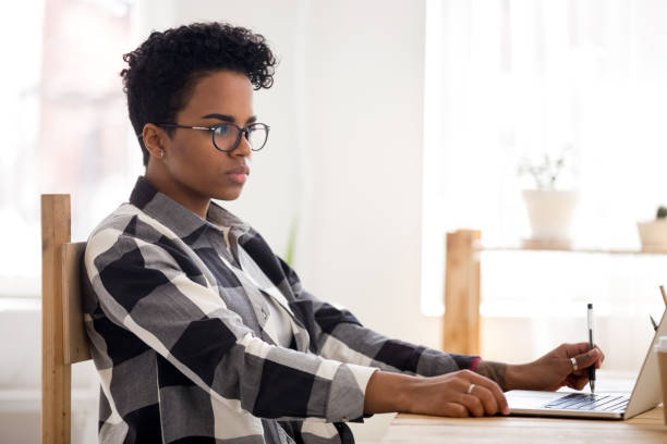 istock Young African woman working studying in office 1063372198