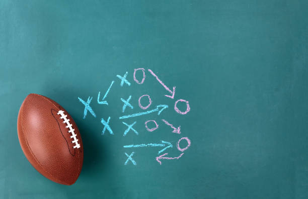 istock American Football with game plan on green chalkboard 1063372936