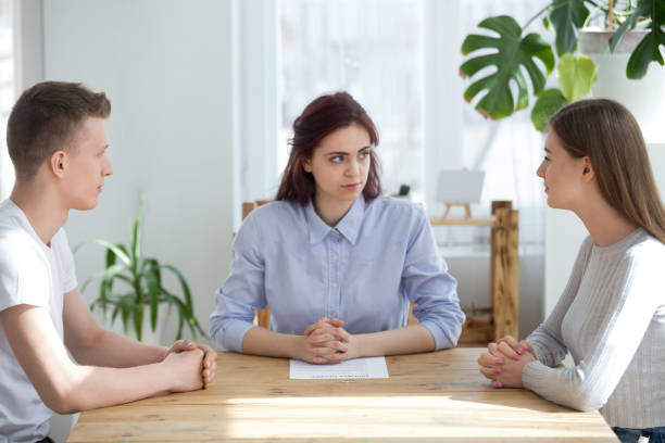 istock Three young people sitting at the desk in office 1063375774