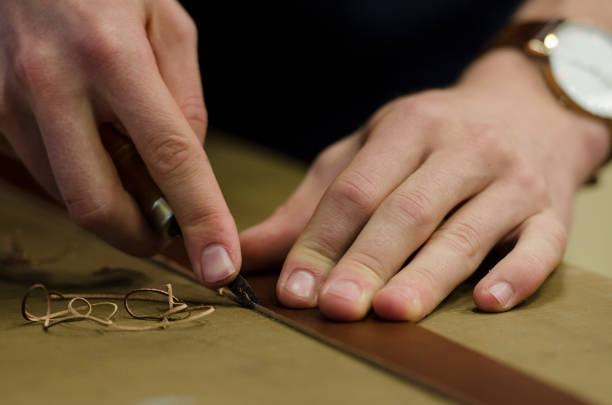 istock Hands working with leather for handicrafts, close up 1063375914
