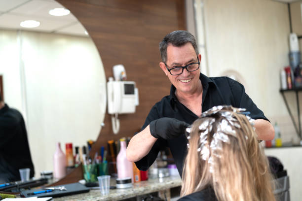 istock Woman getting her hair dyed at salon 1063376328