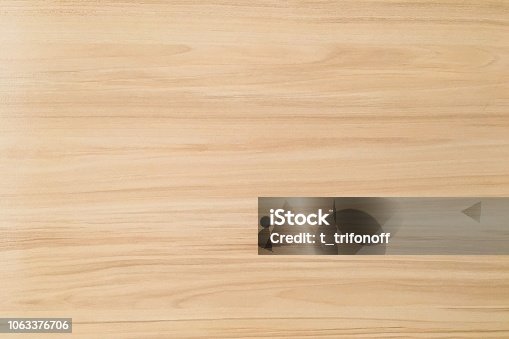 istock wood texture background, light weathered rustic oak. faded wooden varnished paint showing woodgrain texture. hardwood washed planks pattern table top view. 1063376706