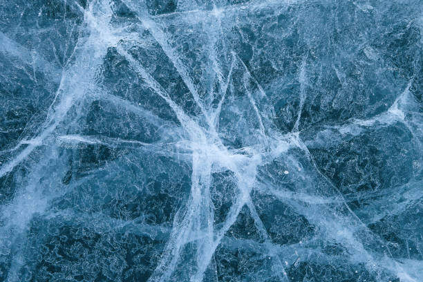 istock cracked texture of ice on Baikal lake, Winter 1063378736