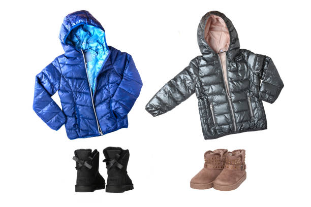 Children"u2019s winter jackets and boots. A collage set of children's blue and black warm down jacket and a matching winter boots isolated on white background. Children winter fashion. Children"u2019s winter jackets and boots. A collage set of children's blue and black warm down jacket and a matching winter boots isolated on white background. Children winter fashion. coat jacket winter isolated stock pictures, royalty-free photos & images