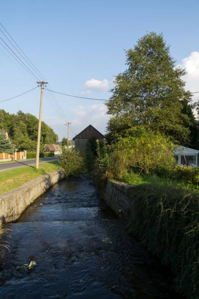 Water stream in the small village in nature.