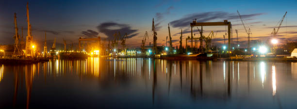 industrial areas, shipyard and port after sunset - szczecin, poland - industry szczecin europe nautical vessel imagens e fotografias de stock