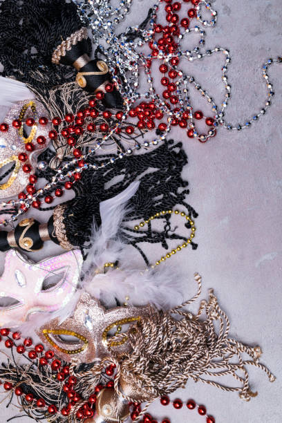 istock Carnival masks and christmas decoration on a grey background. 1063390518