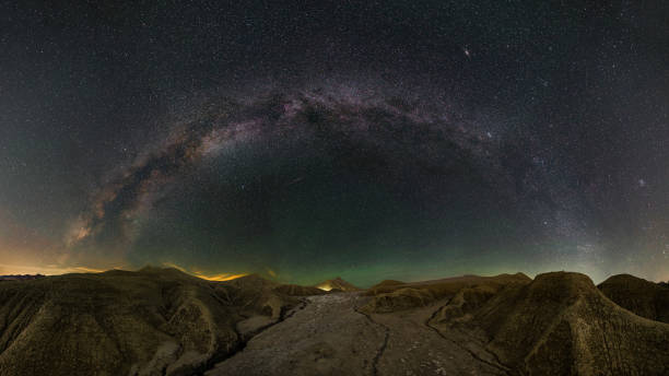 istock Milky Way panorama over volcano landscape 1063394690