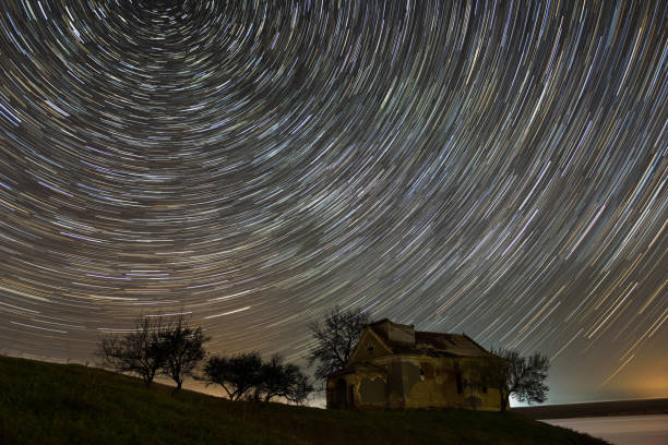 istock Star trails over an abandoned church 1063394746