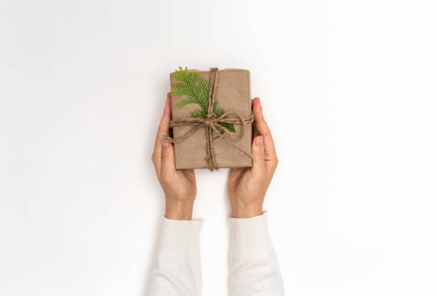 istock Person holding a Christmas gift box 1063400252