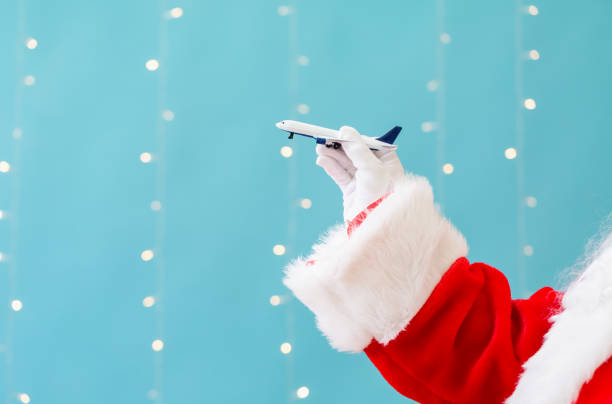 Santa holding a toy airplane
