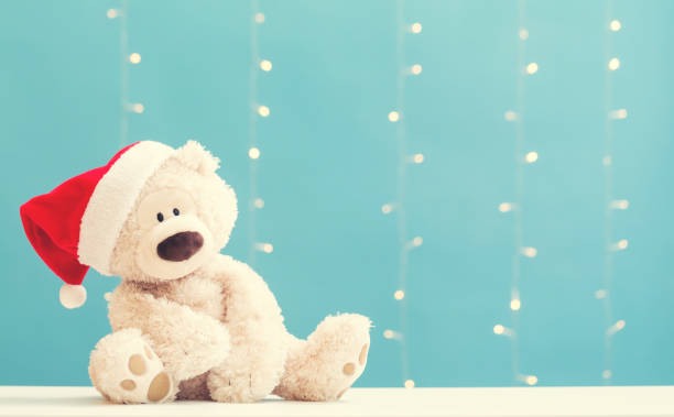 Teddy bear wearing a Santa hat stock photo