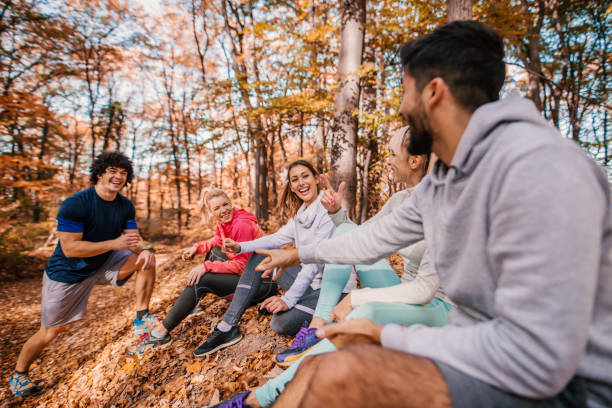 istock Group of runners sitting and chatting after running. 1063418886