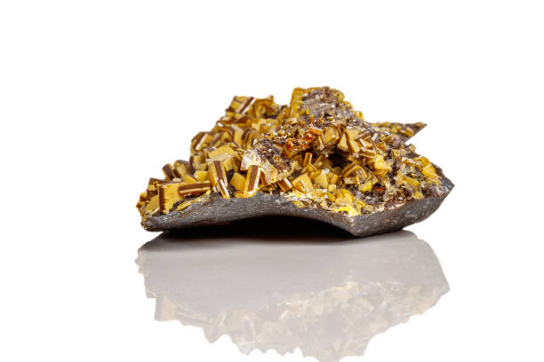 istock Macro mineral stone yellow Wulfenite on a white background 1063419922