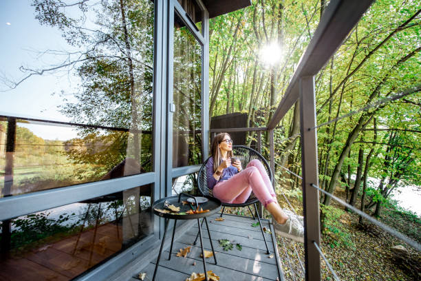 istock Woman on the balcony in the forest 1063421934
