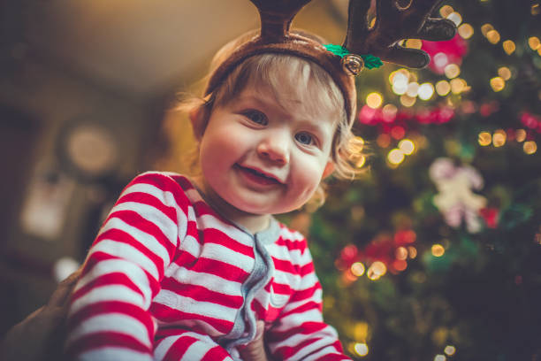 istock Cute boy near Christmas tree indoors 1063424502