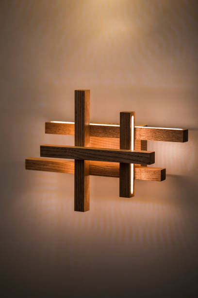 istock Geometric wooden wall lamp. Led light lamp illuminated 1063426184