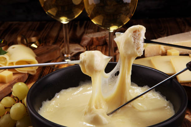 istock Gourmet Swiss fondue dinner on a winter evening with assorted cheese 1063431276
