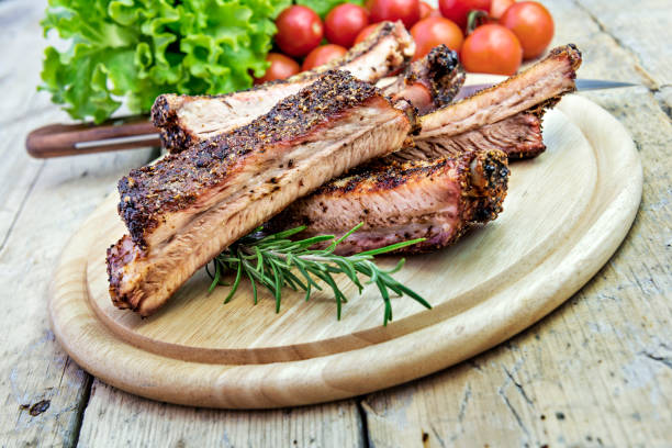 istock Round chopping board with grilled pork ribs 1063432146