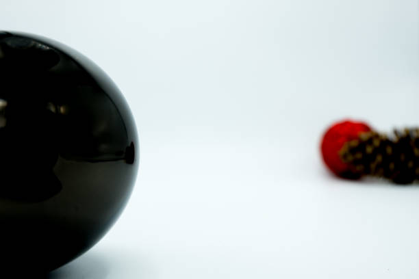 istock Red and black christmas balls with pine cone. 1063440712