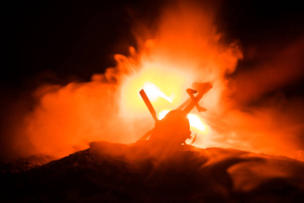 istock Air Crash. Burning falling helicopter. Destroyed helicopter. Decorated with toy at dark fire background 1063441486