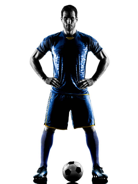 istock soccer player man standing silhouette isolated 1063442618