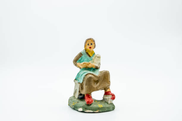 istock Christian nativity scene figure isolated on white. Seamstress. 1063442652