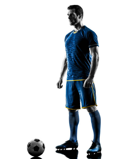 istock soccer player man standing silhouette isolated 1063442686