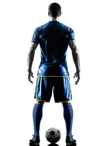istock soccer player man standing back  silhouette isolated 1063442718