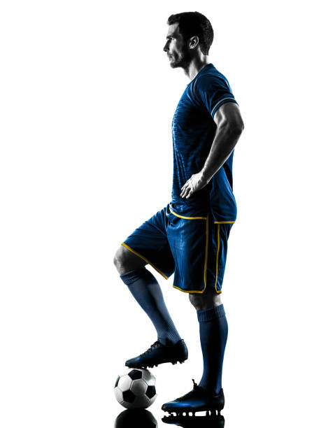 istock soccer player man silhouette isolated 1063443786