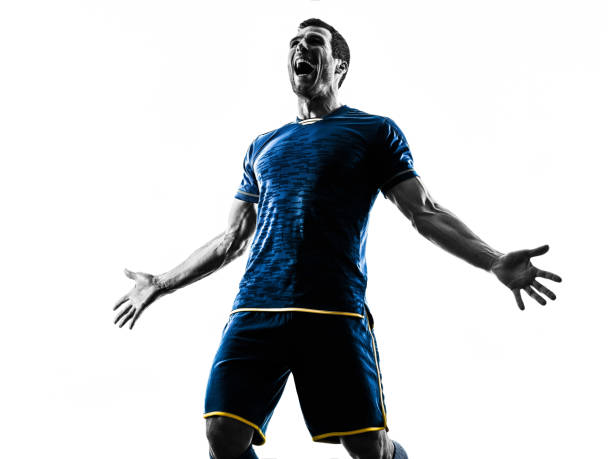 one caucasian soccer player man happy celebration  in silhouette isolated on white background