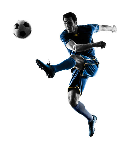 istock soccer player man kicking silhouette isolated 1063444114