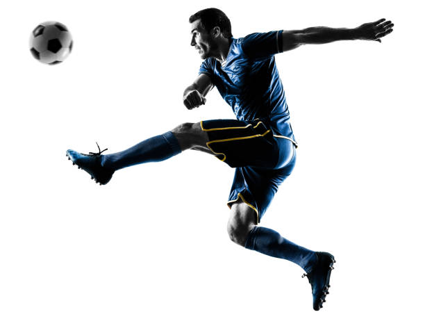 istock soccer player man kicking silhouette isolated 1063444172