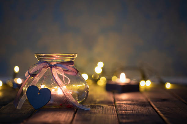 istock Merry Christmas with candle and light bokeh 1063449286