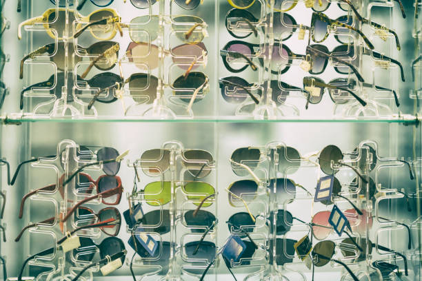 istock Sunglasses on glass shelves in a shop window, a summer accessory 1063449578