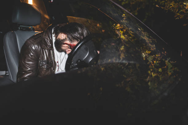istock Hurt driver in a car crash at night 1063456176