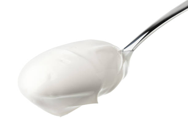 istock sour cream in glass, mayonnaise, yogurt, isolated on white background, clipping path, full depth of field 1063456380