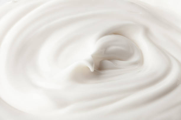istock sour cream in glass, mayonnaise, yogurt, isolated on white background, clipping path, full depth of field 1063456542