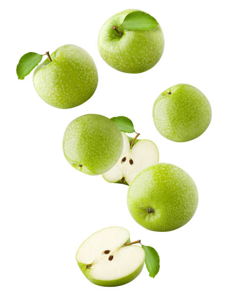 Falling Green juicy apple isolated on white background, clipping path, full depth of field Falling Green juicy apple isolated on white background, clipping path, full depth of field levitation photos stock pictures, royalty-free photos & images