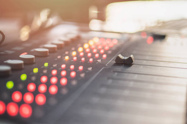 istock Professional audio mixing console with faders and adjusting knobs - radio / TV broadcasting 1063462058