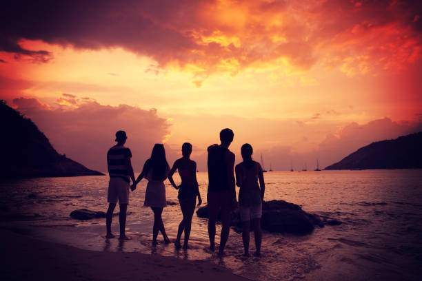 istock Friends on beach at sunset 1063462092