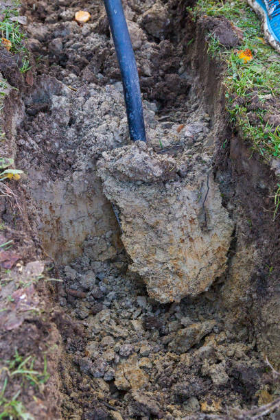 istock Man digging a ditch with a shovel in autumn 1063462154