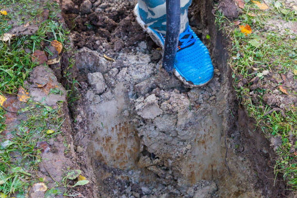 istock Man digging a ditch with a shovel in autumn 1063462162