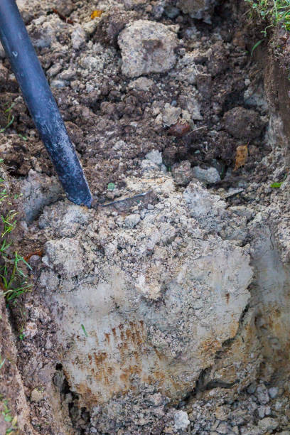 istock Man digging a ditch with a shovel in autumn 1063462184
