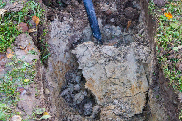 istock Man digging a ditch with a shovel in autumn 1063462220